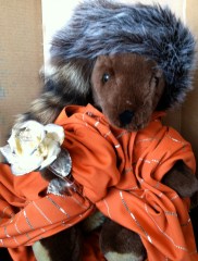 Joey holds a silver rose.